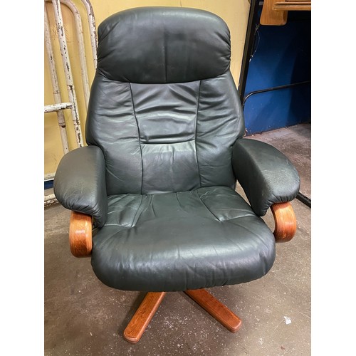 75 - STRESSLESS TYPE DARK GREEN LEATHER SWIVEL CHAIR AND FOOTSTOOL