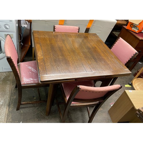 96 - UTILITY OAK DRAWER LEAF TABLE, FOUR CHAIRS, AND MATCHING BREAK FRONT SIDEBOARD