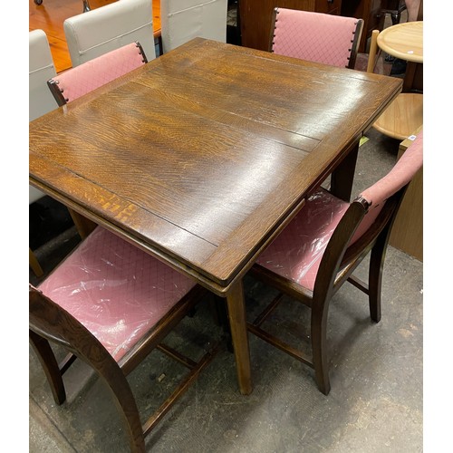 96 - UTILITY OAK DRAWER LEAF TABLE, FOUR CHAIRS, AND MATCHING BREAK FRONT SIDEBOARD