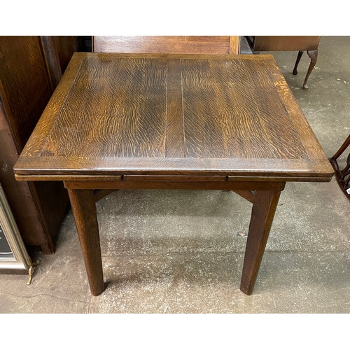 96 - UTILITY OAK DRAWER LEAF TABLE, FOUR CHAIRS, AND MATCHING BREAK FRONT SIDEBOARD