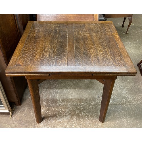 96 - UTILITY OAK DRAWER LEAF TABLE, FOUR CHAIRS, AND MATCHING BREAK FRONT SIDEBOARD