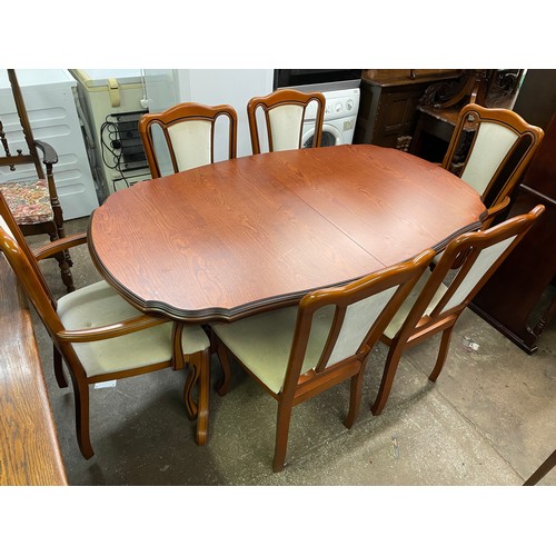 40 - TWIN PEDESTAL SERPENTINE OVAL TOPPED DINING TABLE WITH SIX UPHOLSTERED CHAIRS