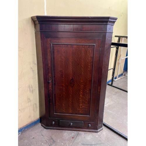 77 - GEORGE III OAK CROSS BANDED HANGING CORNER CUPBOARD WITH INLAID DECORATION