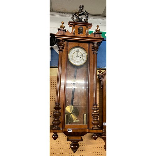 212 - WALNUT CASED DOUBLE WEIGHT PENDULUM WALL CLOCK WITH HORSE CRESTING