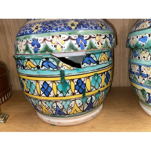 283 - PAIR OF FAIENCE POTTERY JARS AND COVERS A/F