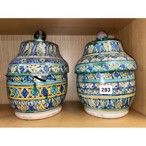 283 - PAIR OF FAIENCE POTTERY JARS AND COVERS A/F