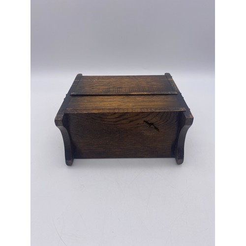 432 - MINIATURE MUSICAL CARVED OAK SETTLE BOX