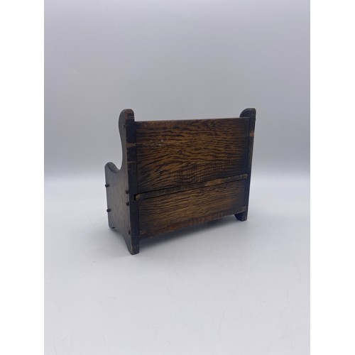 432 - MINIATURE MUSICAL CARVED OAK SETTLE BOX