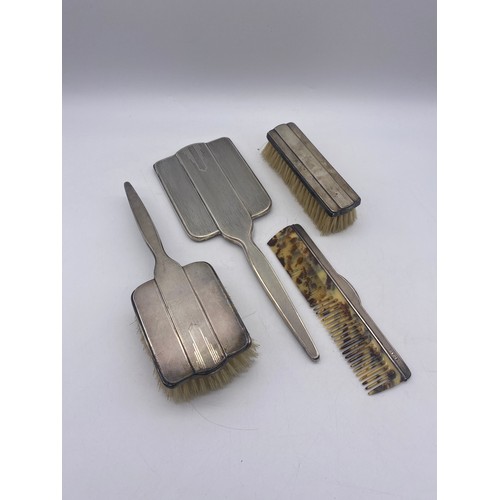 457 - CASED WALKER AND HALL SHEFFIELD SILVER ART DECO DESIGN BRUSH AND COMB TRAVEL SET