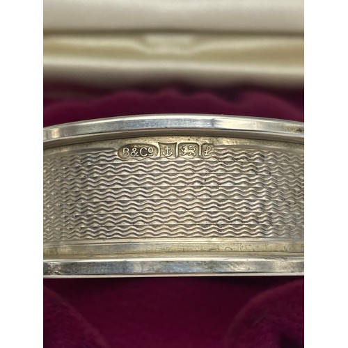 451 - PAIR OF SILVER ENGINE TURNED NAPKIN RINGS AND PLAIN NAPKIN RING 1.4OZ APPROX