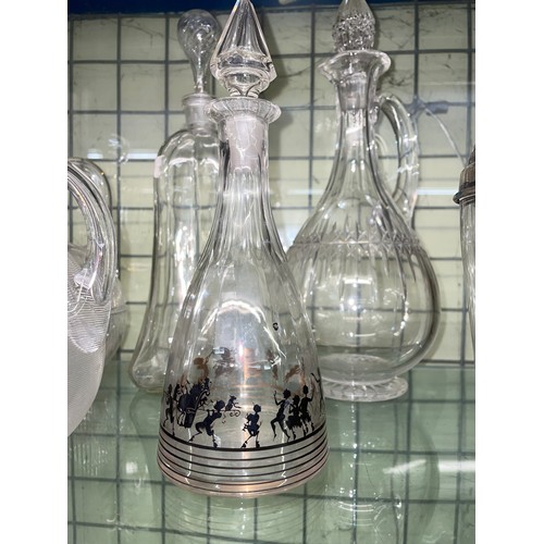 556 - RIBBED ETCHED CLARET JUG AND STOPPER, OTHER CLARET JUGS AND DECANTERS AND A COCKTAIL SHAKER