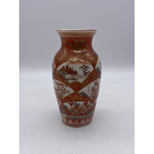 583 - JAPANESE KUTANI RED BALUSTER VASE AND A GLOBULAR VASE DECORATED WITH PRUNUS BLOSSOM