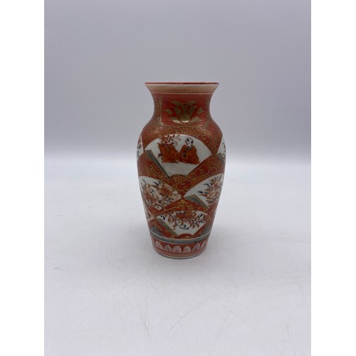 583 - JAPANESE KUTANI RED BALUSTER VASE AND A GLOBULAR VASE DECORATED WITH PRUNUS BLOSSOM