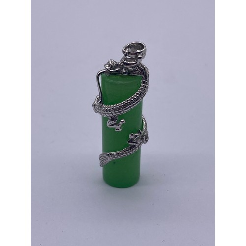 519 - SILVER MOUNTED COILED DRAGON CYLINDER JADE PENDANT, SILVER MOUNTED DISK PENDANT AND PAIR OF PEAR DRO... 