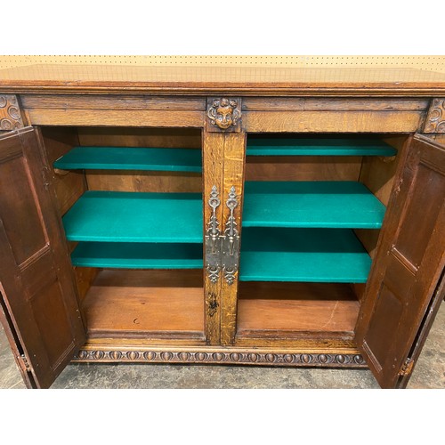 132 - 19TH CENTURY OAK BLOCK PANELLED FRONT CABINET WITH GERMAN STYLE IRON WORK LOCK