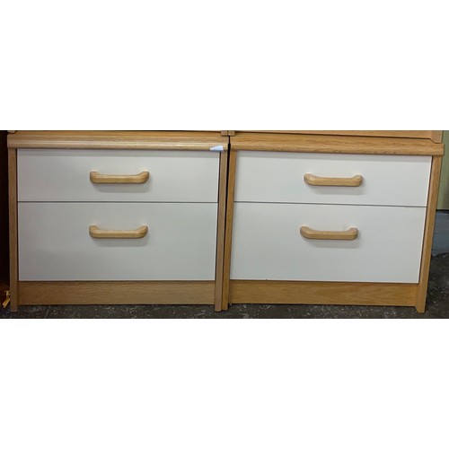 68 - PAIR OF LIGHT BEECH AND CREAM TWO DRAWER BEDSIDE CHESTS