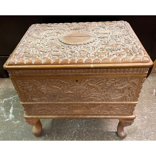 73 - EASTERN CARVED HARDWOOD NEEDLE WORK TRUNK WITH CONTENTS