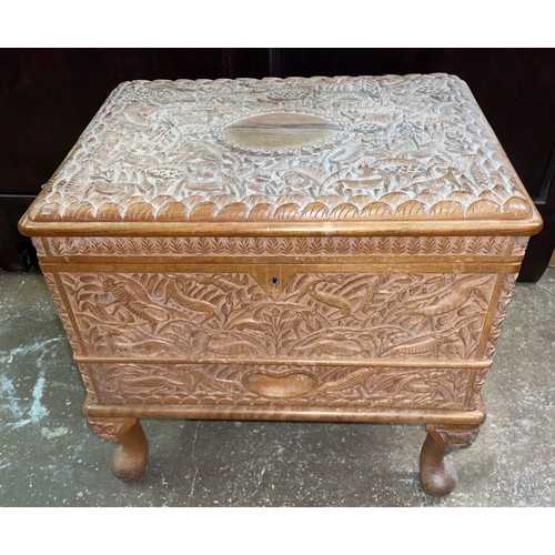 73 - EASTERN CARVED HARDWOOD NEEDLE WORK TRUNK WITH CONTENTS