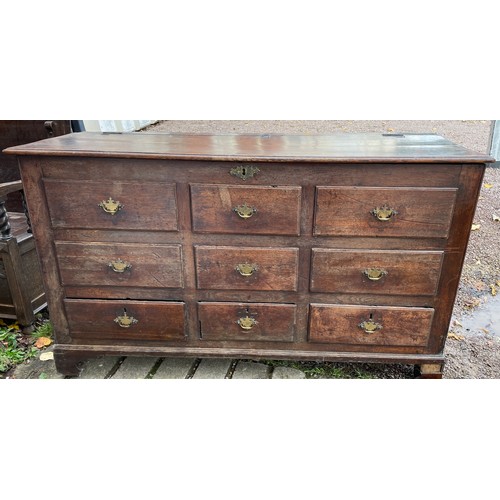 112 - 18TH CENTURY OAK NINE DRAWER MULE CHEST ON BRACKET FEET