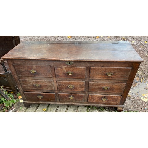 112 - 18TH CENTURY OAK NINE DRAWER MULE CHEST ON BRACKET FEET