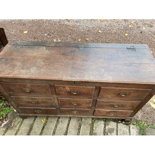 112 - 18TH CENTURY OAK NINE DRAWER MULE CHEST ON BRACKET FEET