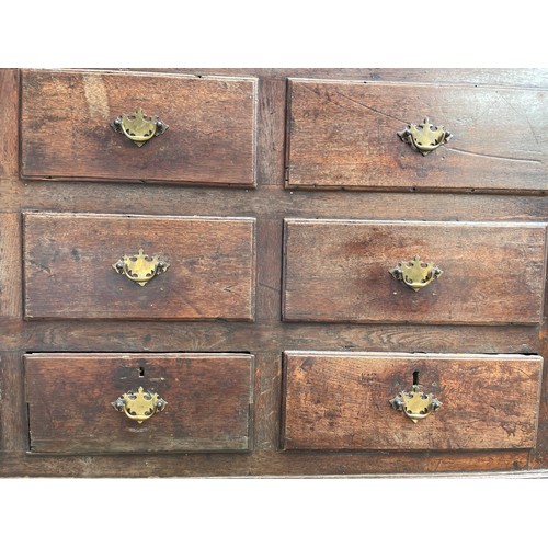 112 - 18TH CENTURY OAK NINE DRAWER MULE CHEST ON BRACKET FEET