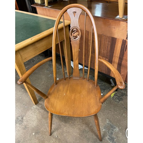 137 - ERCOL ELM SWAN CAMEO BACK ARMCHAIR