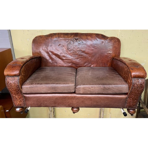 136 - 20TH CENTURY TAN EMBOSSED LEATHER UPHOLSTERED THREE PIECE SUITE