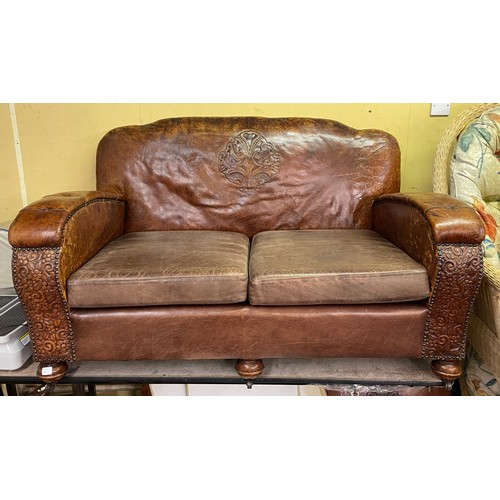 136 - 20TH CENTURY TAN EMBOSSED LEATHER UPHOLSTERED THREE PIECE SUITE