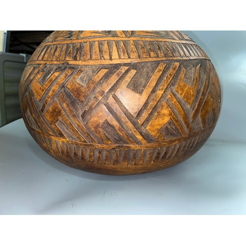 143 - CARVED GOURD AND VASE OF ARTIFICIAL FLOWERS