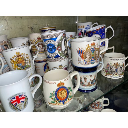 310 - TWO SHELVES OF ROYAL COMMEMORATIVE WARE, KING GEORGE V, QUEEN ELIZABETH II AND OTHERS