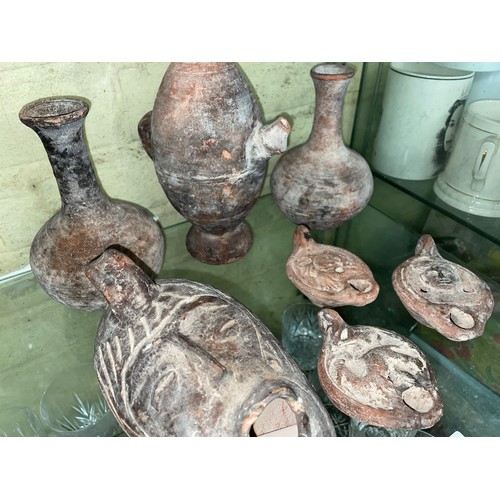 305 - HALF SHELF OF ARCHAIC POTTERY, ROMAN STYLE OIL LAMPS AND VASES