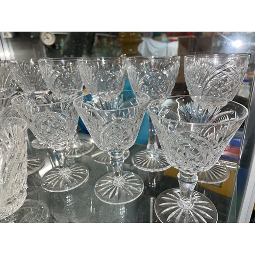 257 - SHELF OF GOOD QUALITY CUT GLASSWARE INCLUDING WINE GLASSES