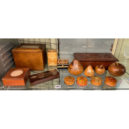 287 - SHELF OF CARVED WOODEN BOXES, ORNAMENTAL TURNED FRUIT, STRAW WORK BOX, AND CASHS SILK BOX