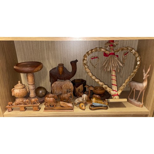 269 - SHELF OF CARVED ANIMAL ORNAMENTS, MAINLY ELEPHANTS, TURNED WOODEN BOWL AND FRUIT