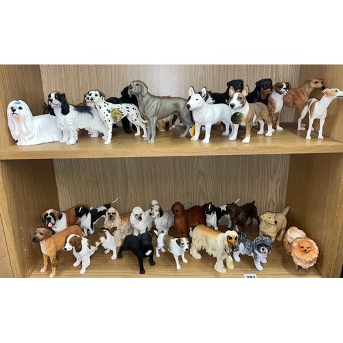 263 - TWO SHELVES OF LEONARDO COLLECTION DOG FIGURES