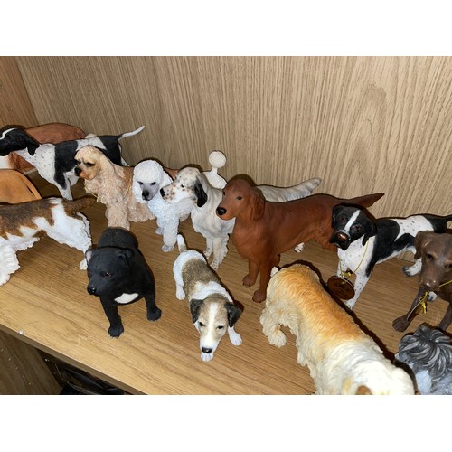 263 - TWO SHELVES OF LEONARDO COLLECTION DOG FIGURES