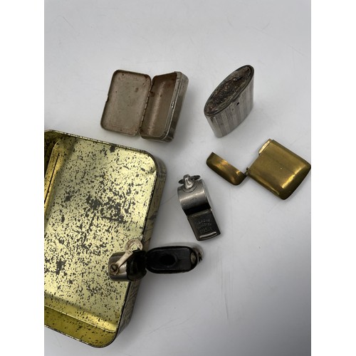 588 - TIN CONTAINING ACME THUNDERER WHISTLE, BASE METAL VESTA CASES, TRAVELLING INKWELL