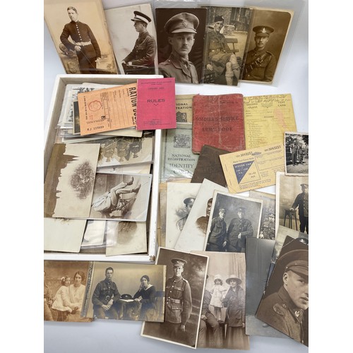 584 - TRAY OF INTERESTING MILITARY RELATED PHOTOGRAPHIC CARDS AND POSTCARDS, SOLDIERS SERVICE BOOK AND ID ... 