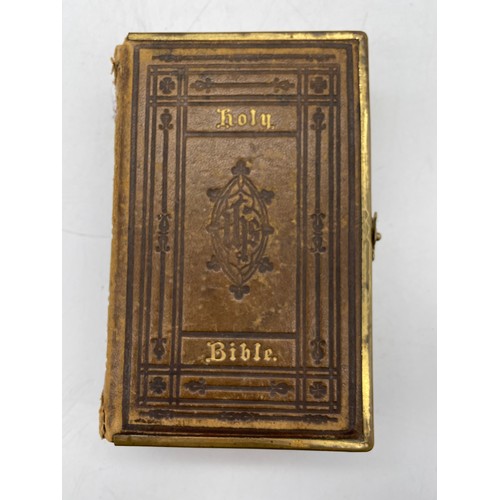 245 - LEATHER BOUND HOLY BIBLE WITH GILT METAL CLASP