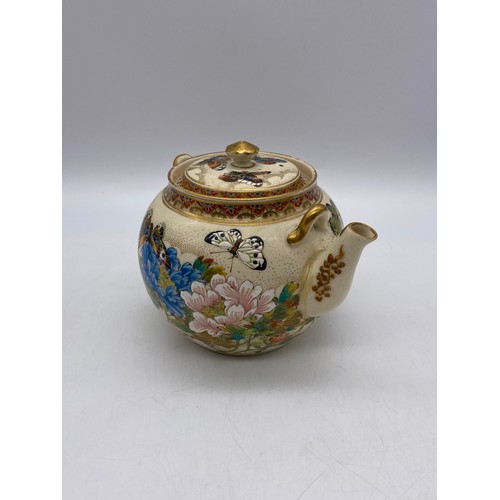 543 - JAPANESE SATSUMA EARTHERNWARE SQUAT TEAPOT DECORATED WITH BUTTERFLIES AND FOLIAGE A/F