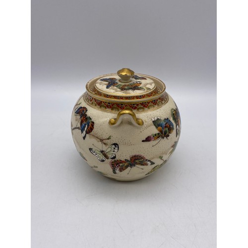 543 - JAPANESE SATSUMA EARTHERNWARE SQUAT TEAPOT DECORATED WITH BUTTERFLIES AND FOLIAGE A/F