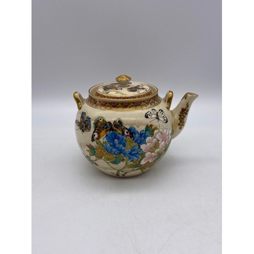 543 - JAPANESE SATSUMA EARTHERNWARE SQUAT TEAPOT DECORATED WITH BUTTERFLIES AND FOLIAGE A/F