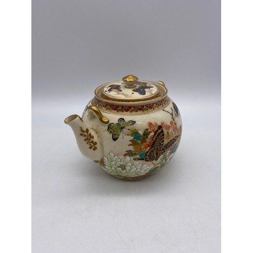 543 - JAPANESE SATSUMA EARTHERNWARE SQUAT TEAPOT DECORATED WITH BUTTERFLIES AND FOLIAGE A/F