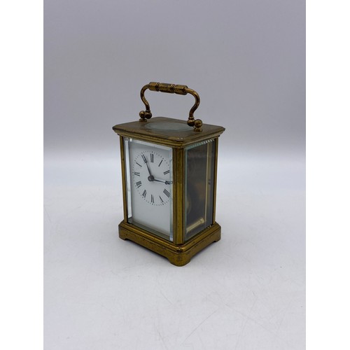 549 - BRASS LAQUERED CASED CARRIAGE CLOCK WITH KEY