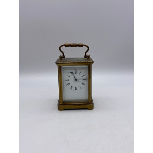 549 - BRASS LAQUERED CASED CARRIAGE CLOCK WITH KEY