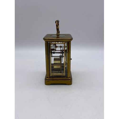 549 - BRASS LAQUERED CASED CARRIAGE CLOCK WITH KEY