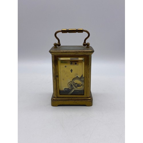 549 - BRASS LAQUERED CASED CARRIAGE CLOCK WITH KEY