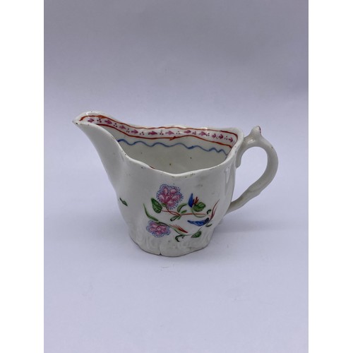 459 - 18TH CENTURY WRYTHEN MOULDED CREAM JUG WITH FLORAL SPRAY DECORATION