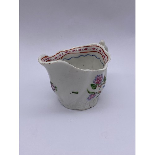 459 - 18TH CENTURY WRYTHEN MOULDED CREAM JUG WITH FLORAL SPRAY DECORATION